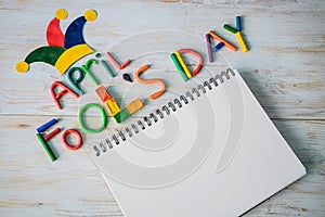 April Fools` Day text made with plasticine and free space in note