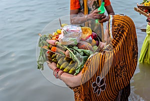 An unidentified Indian woman praying to River Ganga/ Ganges.