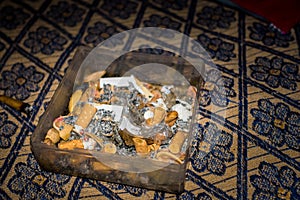 April 12th 2022. Dehradun,Uttarakhand,India. A close up shot of pile of smoked cigarette buds and cigar in an ash tray