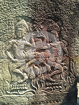 Apsara dancers carved on the wall of Prasat Bayon Khmer ancient temple. Angkor Wat in Siem Reap, Cambodia.