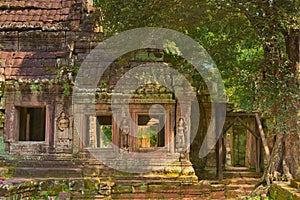 Apsaras in bas-relief on the columns of Ta Prohm temple ruins, located in Angkor Wat complex near Siem Reap, Cambodia.