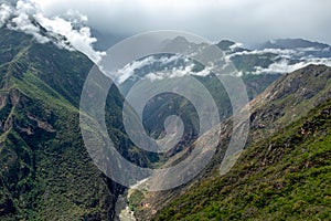 Apurimac river : Green steep slopes of valley with water in the middle, the Choquequirao trek, Peru photo