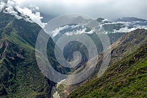 Apurimac river : Green steep slopes of valley with water in the middle, the Choquequirao trek, Peru