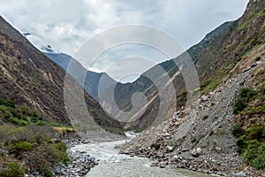 Apurimac river : Green steep slopes of valley with water in the middle, the Choquequirao trek, Peru