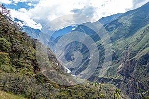The Apurimac river valley: Green steep slopes of deep canyon with lush vegetation, the Choquequirao trek, Peru