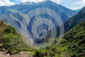 The Apurimac river valley: Green steep slopes of deep canyon with lush vegetation, the Choquequirao trek, Peru