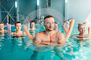 Aqua aerobics traninig, women group, male trainer