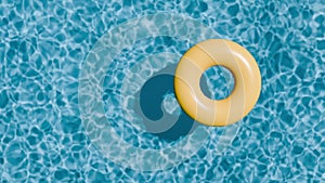 Aqua life preserver adrift in an azure swimming pool