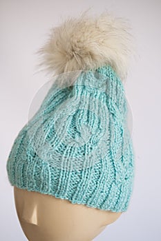 Aquamarine Knitted Beanie with Pompom on Mannequin