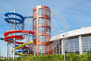 Aquapark bulding outside, Colourful plastic slides photo