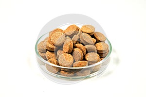 Aquarium fish Feed tablets closeup. Ornamental fish food, fish food pressed into tablets