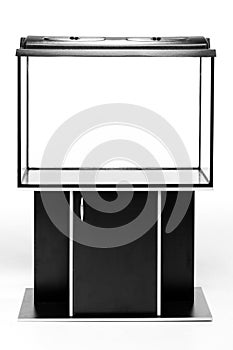 Aquarium large, transparent with a curbstone on a white background photo