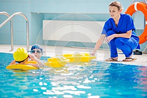 Aquatic Rehabilitation With Therapist And Two Patients