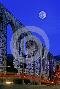 Aqueduct with moon photo
