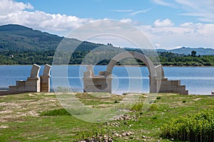 Roman ruins with lake. Aquis Querquennis archaeological site, arched stone door. BaÃÂ±os de Bande, Orense, Spain photo