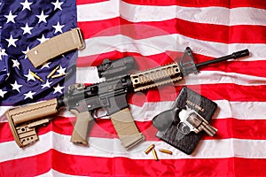 AR Rifle, a Bible & a Pistol on American Flag photo