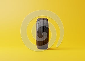 Ð¡ar tire on a yellow background