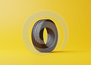 Ð¡ar tire on a yellow background