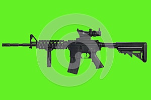 AR15 assault rifle with optic sight and a foregrip on green background