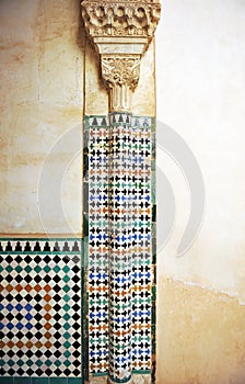 Mosaic of tiles and column, Alhambra palace in Granada, Spain photo