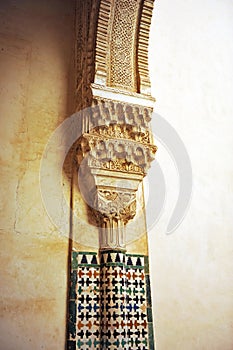 Mosaic of tiles and column, Alhambra palace in Granada, Spain photo