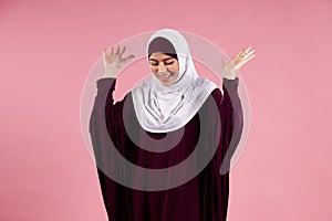 Arab attractive woman in hijab lets things go