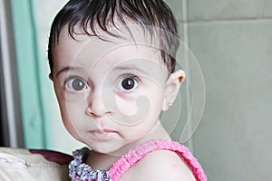 Arab baby girl staring
