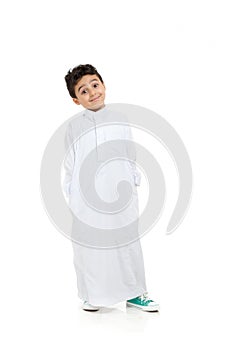 Arab boy relaxed and smiling with raised eye brows