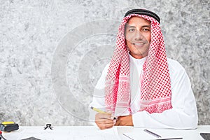 Arab business man sitting at a desk