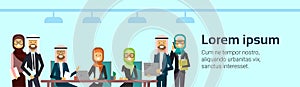 Arab business people group meeting together sit at office desk , muslim businesspeople team training brainstorming