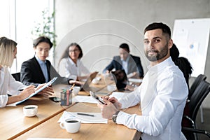 Arab Businessman At Business Meeting Sitting At Desk In Office