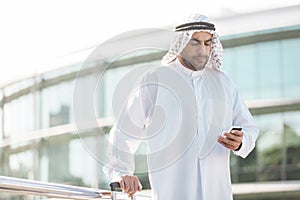 Arab businessman with mobile phone photo