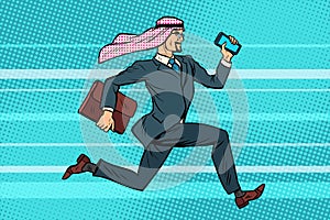 Arab businessman runs forward, phone and briefcase in hand