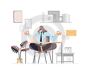 arab businessman sitting lotus pose at workplace business man doing yoga exercise meditation relaxation concept