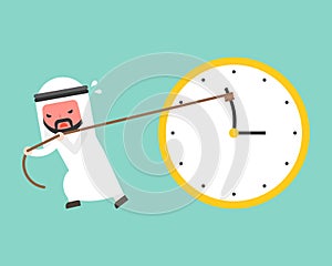 Arab businessman try hard to pull back minute hand anti clockwise by rope
