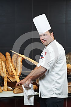 Arab chef cutting bread