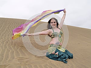 Arab dancer with a color cloth at desert