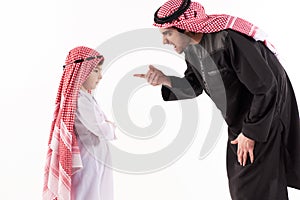 Arab dissatisfied father scolds son in ethnic