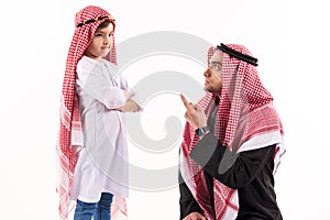 Arab dissatisfied father scolds son in ethnic