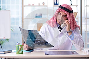 The arab doctor radiologist working in the clinic