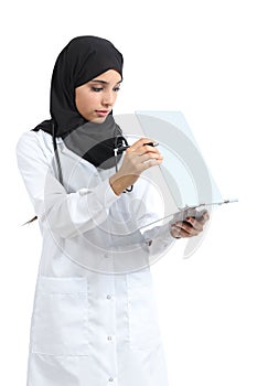 Arab doctor woman reading a clinical history