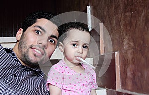 Arab egyptian man with his baby girl