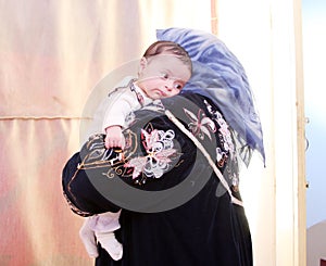 Arab egyptian newborn baby girl with grandmother