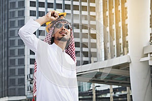 Arab Engineer construction worker holding helmet construction