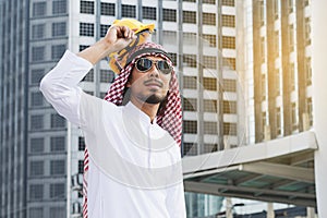 Arab Engineer construction worker holding helmet construction