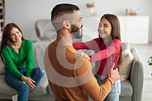 Arab girl celebrating father& x27;s day, greeting dad