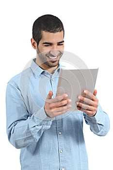 Arab happy casual man holding and reading a tablet reader