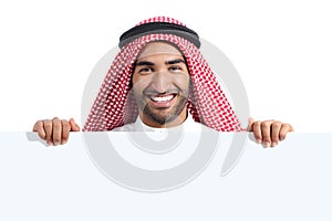 Arab happy saudi man displaying a banner sign