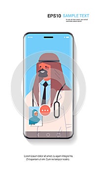 Arab male doctor consulting female patient during video call online consultation healthcare medicine