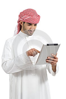 Arab man browsing a digital tablet